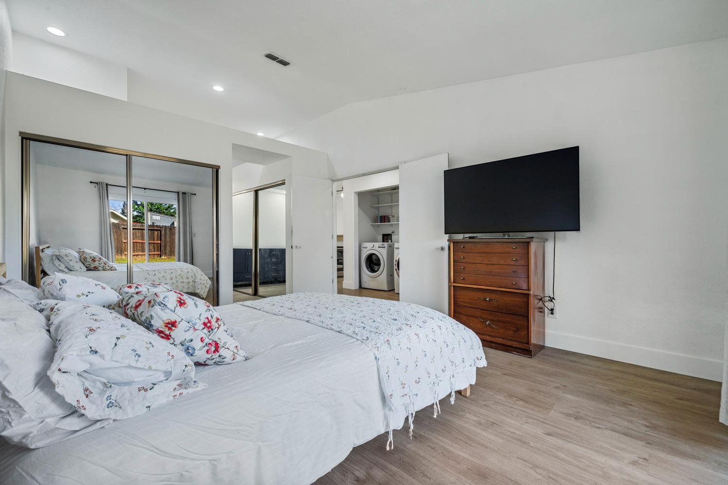 9488 Dunkerrin Way Elk Grove, CA 95758 - Photo 24 of 43 a bedroom with a bed and a flat screen tv