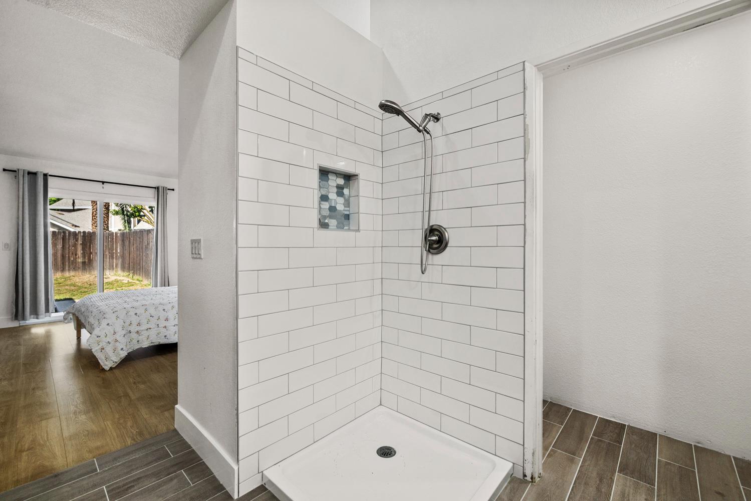 9488 Dunkerrin Way Elk Grove, CA 95758 - Photo 26 of 43 a bathroom with a shower