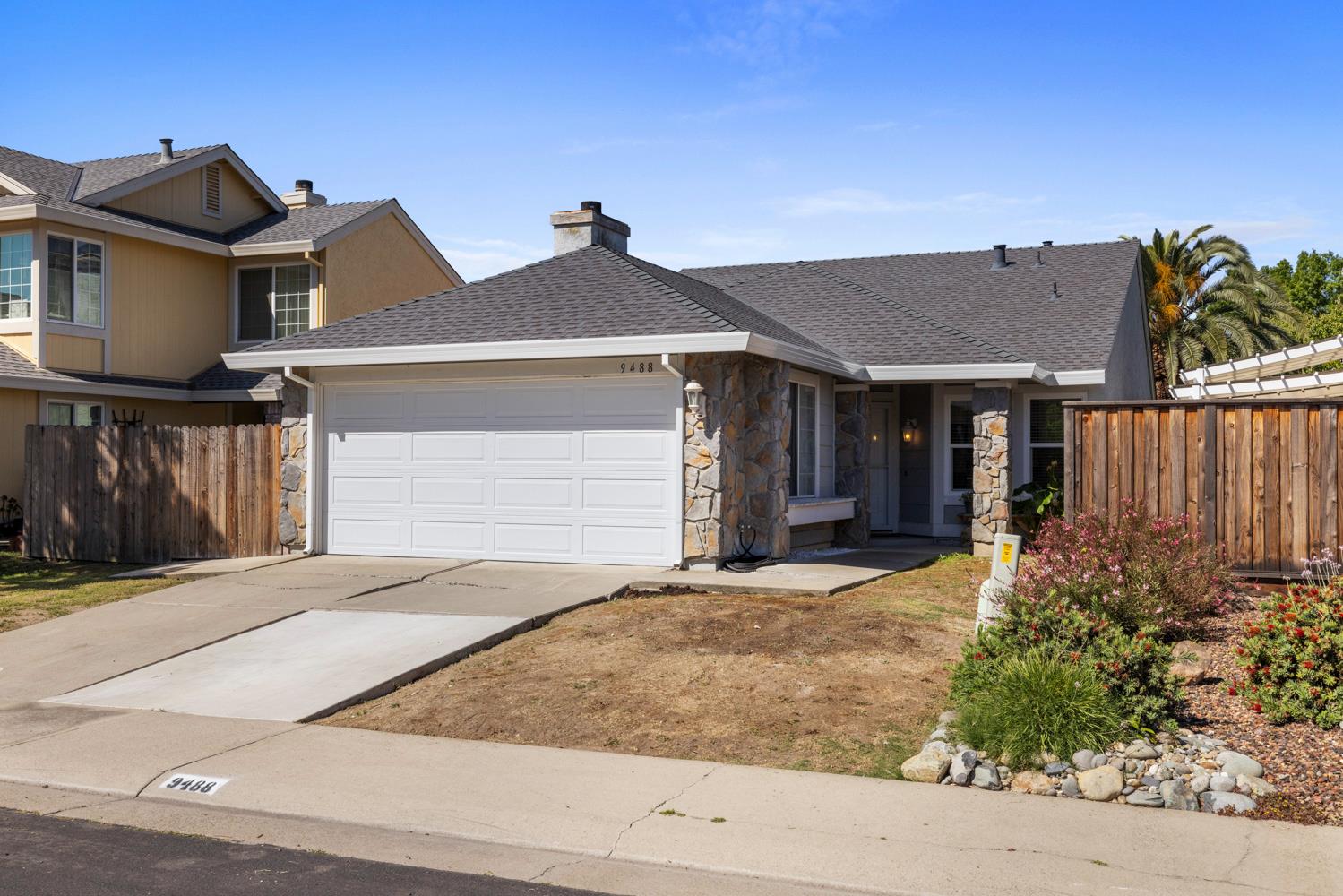 9488 Dunkerrin Way Elk Grove, CA 95758 - Photo 3 of 43 a front view of a house with garden