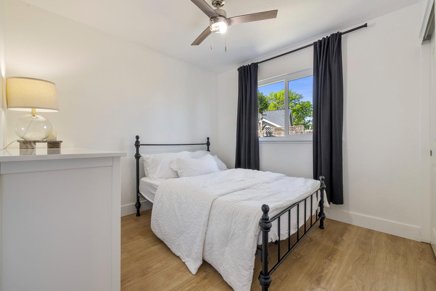 9488 Dunkerrin Way Elk Grove, CA 95758 - Photo 31 of 43 a bedroom with a bed and a window
