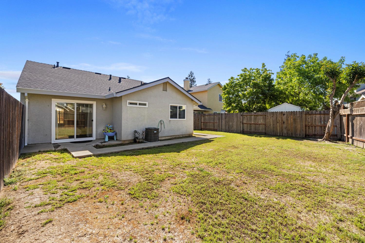 9488 Dunkerrin Way Elk Grove, CA 95758 - Photo 36 of 43 a view of a house with swimming pool and a yard