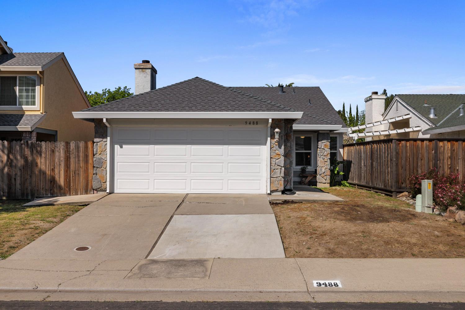9488 Dunkerrin Way Elk Grove, CA 95758 - Photo 4 of 43 a front view of a house with yard