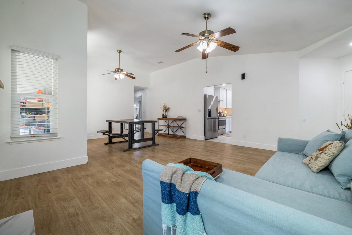 9488 Dunkerrin Way Elk Grove, CA 95758 - Photo 10 of 43 a living room with furniture and kitchen view