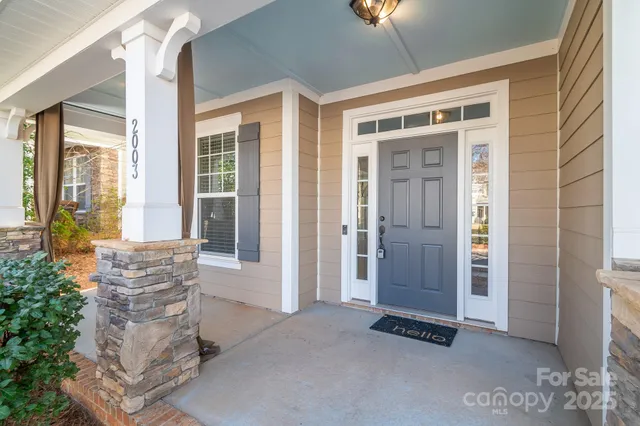 a view of an entryway with wooden floor and windows