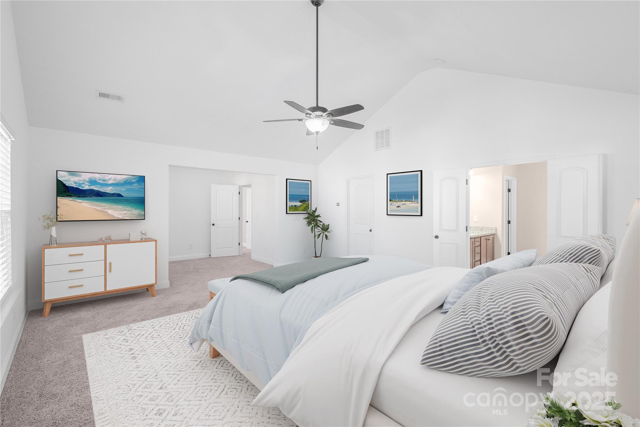 2003 Fallondale Road Waxhaw, NC 28173 - Photo 17 of 27 a spacious bedroom with a bed a window and a ceiling fan