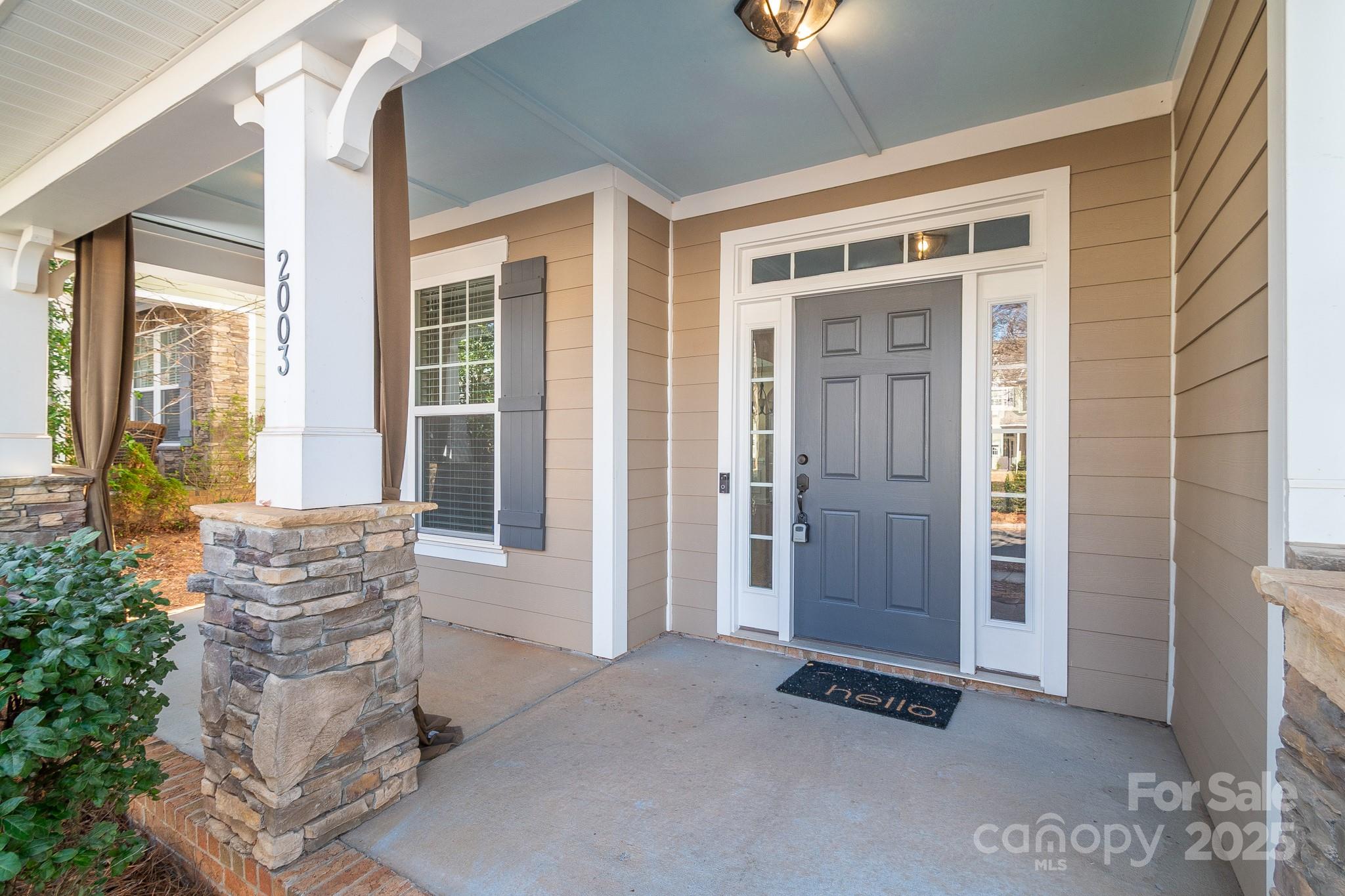 2003 Fallondale Road Waxhaw, NC 28173 - Photo 2 of 27 a view of an entryway with wooden floor and windows