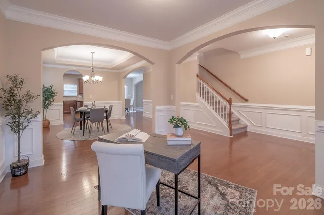 a view of a dining room with furniture and wooden floor