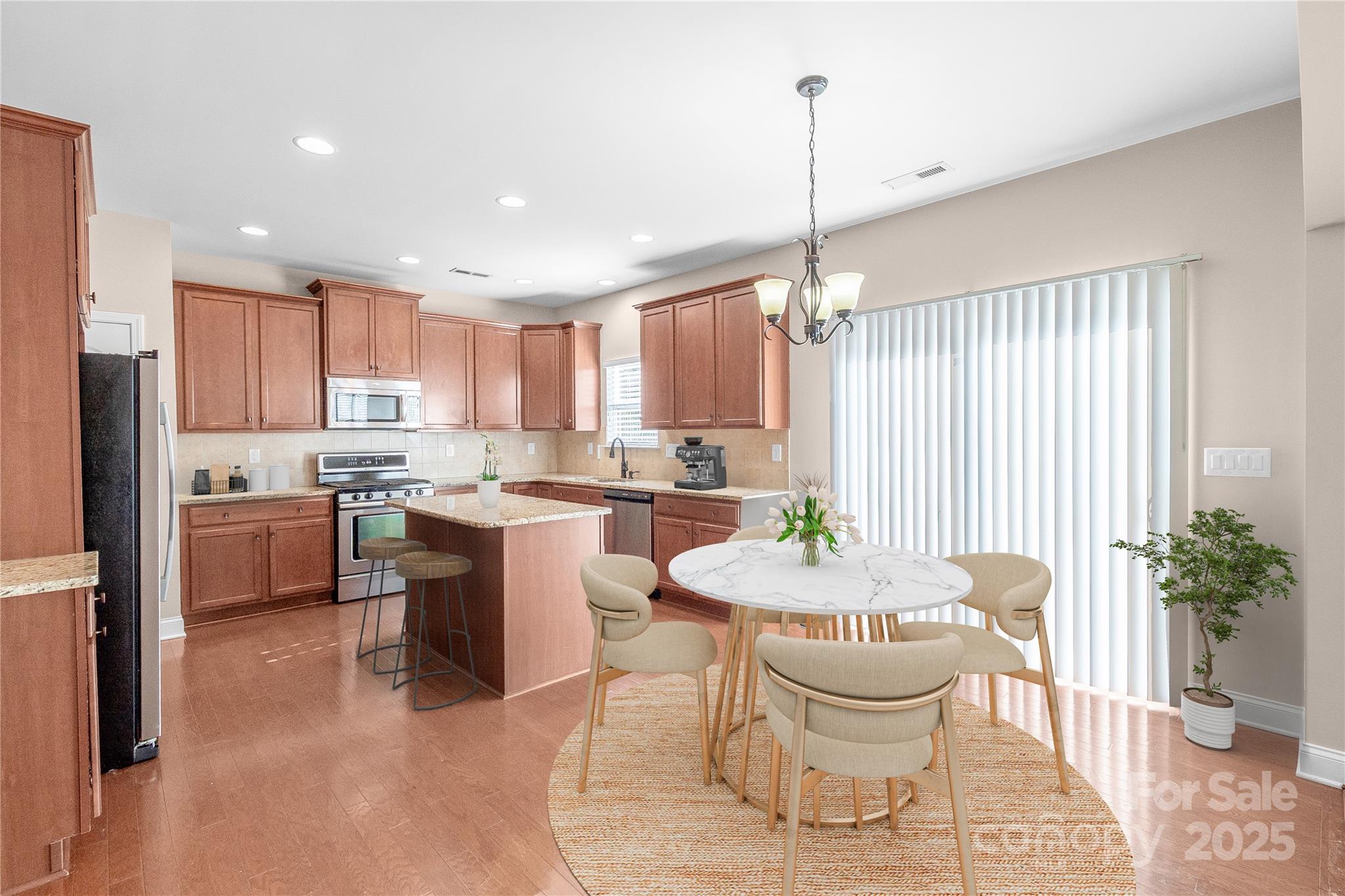 2003 Fallondale Road Waxhaw, NC 28173 - Photo 8 of 27 a large kitchen with a table and chairs