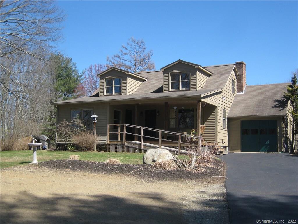 203 County Road Woodstock, CT 06281 - Photo 1 of 1 a front view of a house with garden
