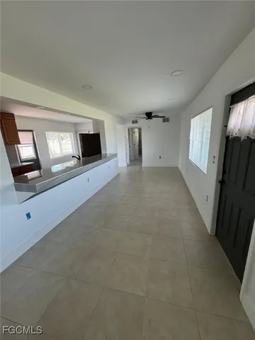 a large kitchen with a large window