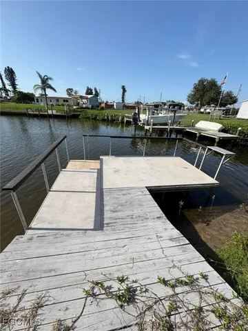 a room with furniture and a refrigerator
