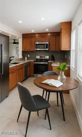 a kitchen with stainless steel appliances granite countertop a sink and cabinets