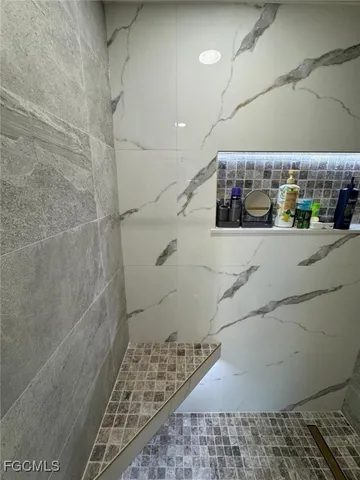 a bathroom with a sink mirror and toilet