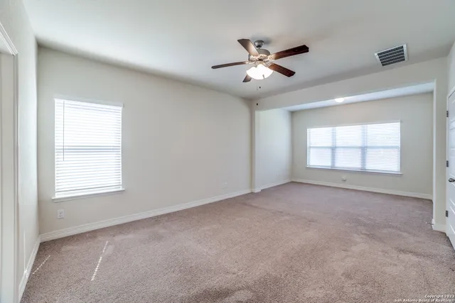 a view of empty room with windows