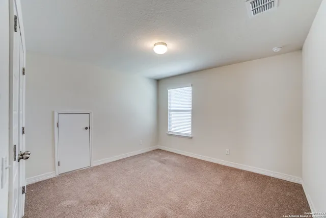 an empty room that has a window