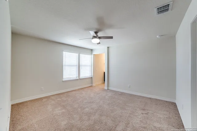 a bathroom with a shower and a sink
