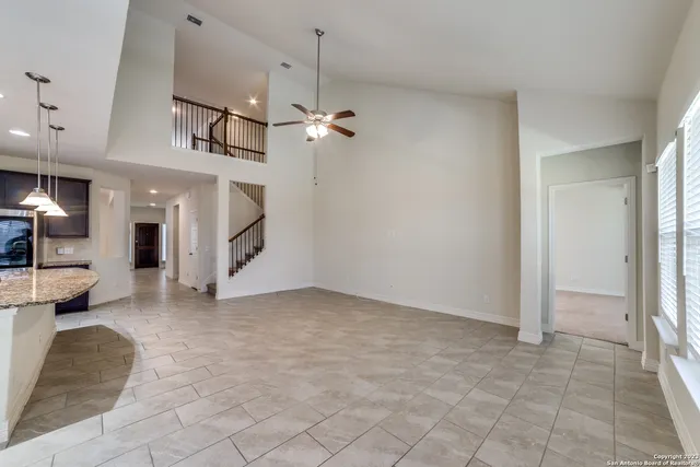 a kitchen with kitchen island a sink stainless steel appliances and cabinets