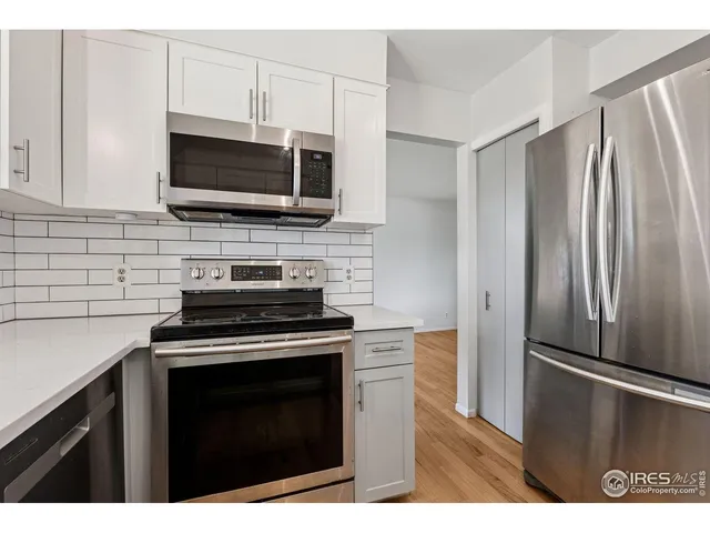 a kitchen with a stove microwave and refrigerator