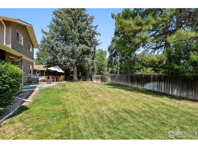 a swimming pool with wooden fence