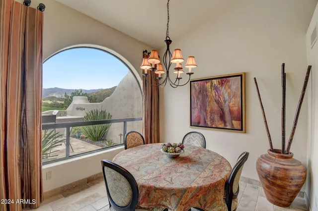 a kitchen that has a lot of cabinets in it