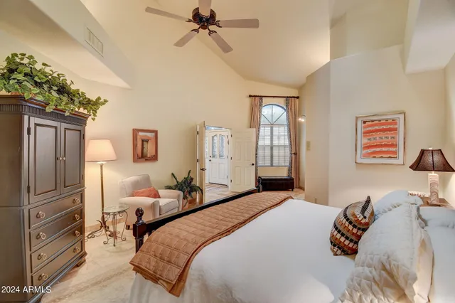 a en suite bathroom with a granite countertop double vanity sink and a mirror