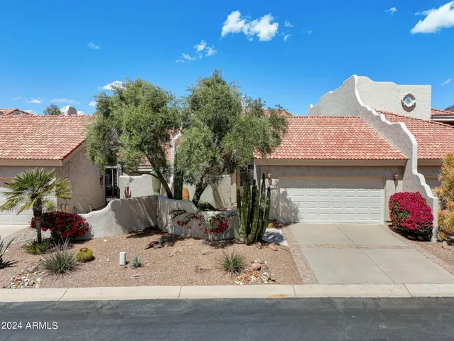 an aerial view of a house with a garden