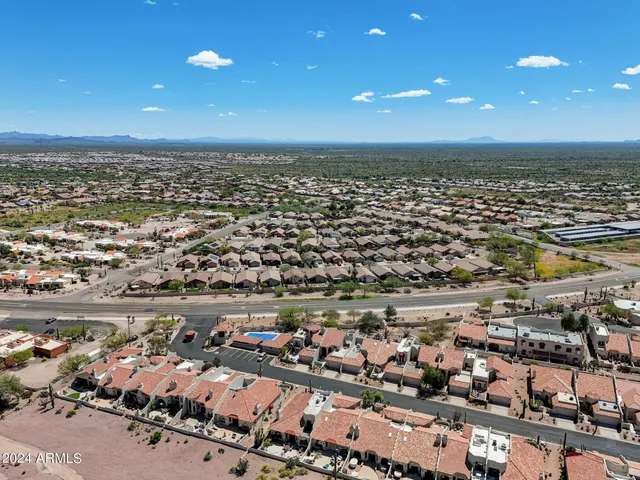 an aerial view of a house with a lot of city