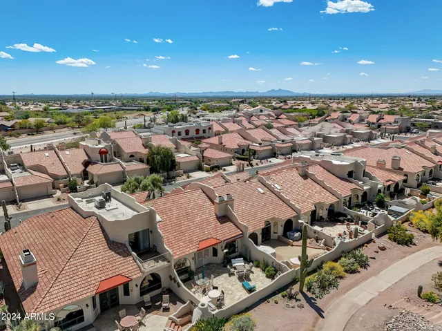 a front view of a house with sitting area