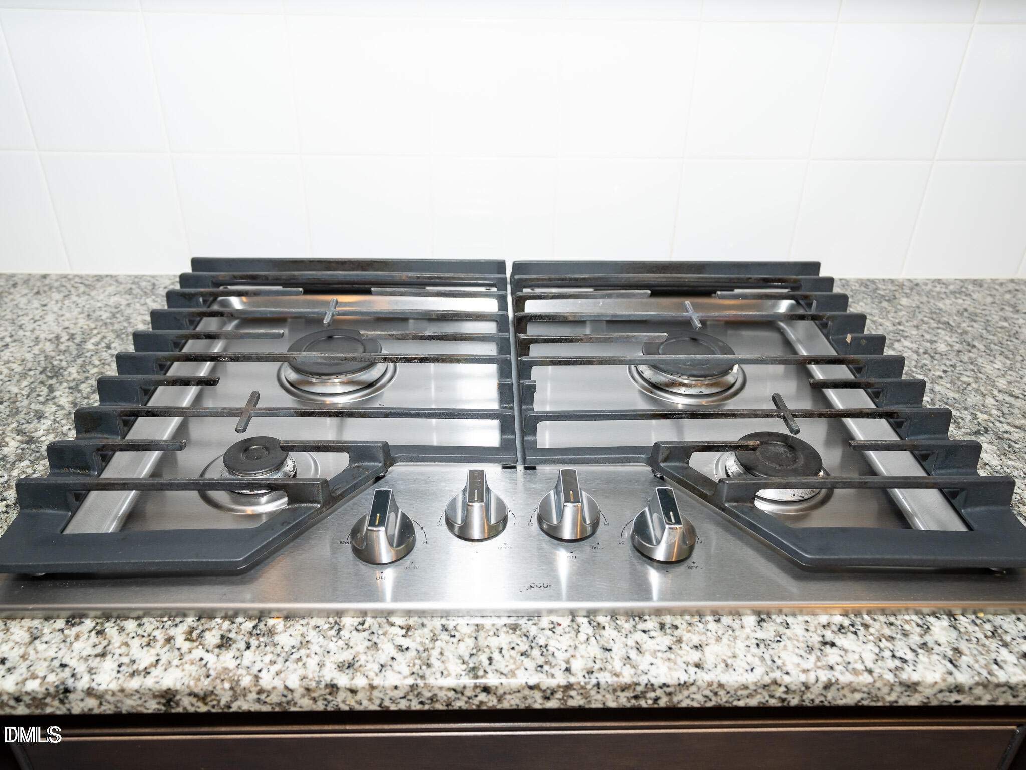 647 Newlyn Drive Raleigh, NC 27606 - Photo 13 of 52 a view of water heater and room with wooden floor