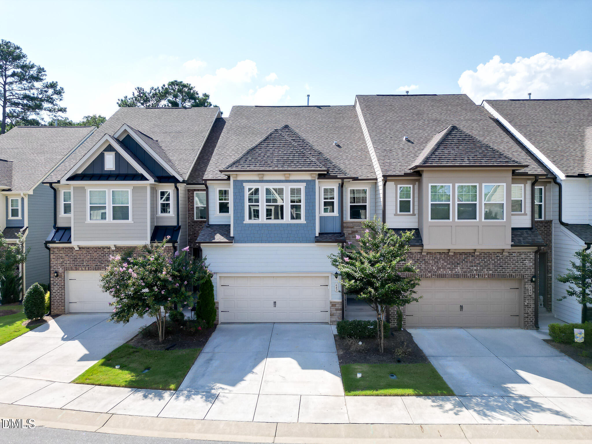 647 Newlyn Drive Raleigh, NC 27606 - Photo 2 of 52 a front view of a house with a yard