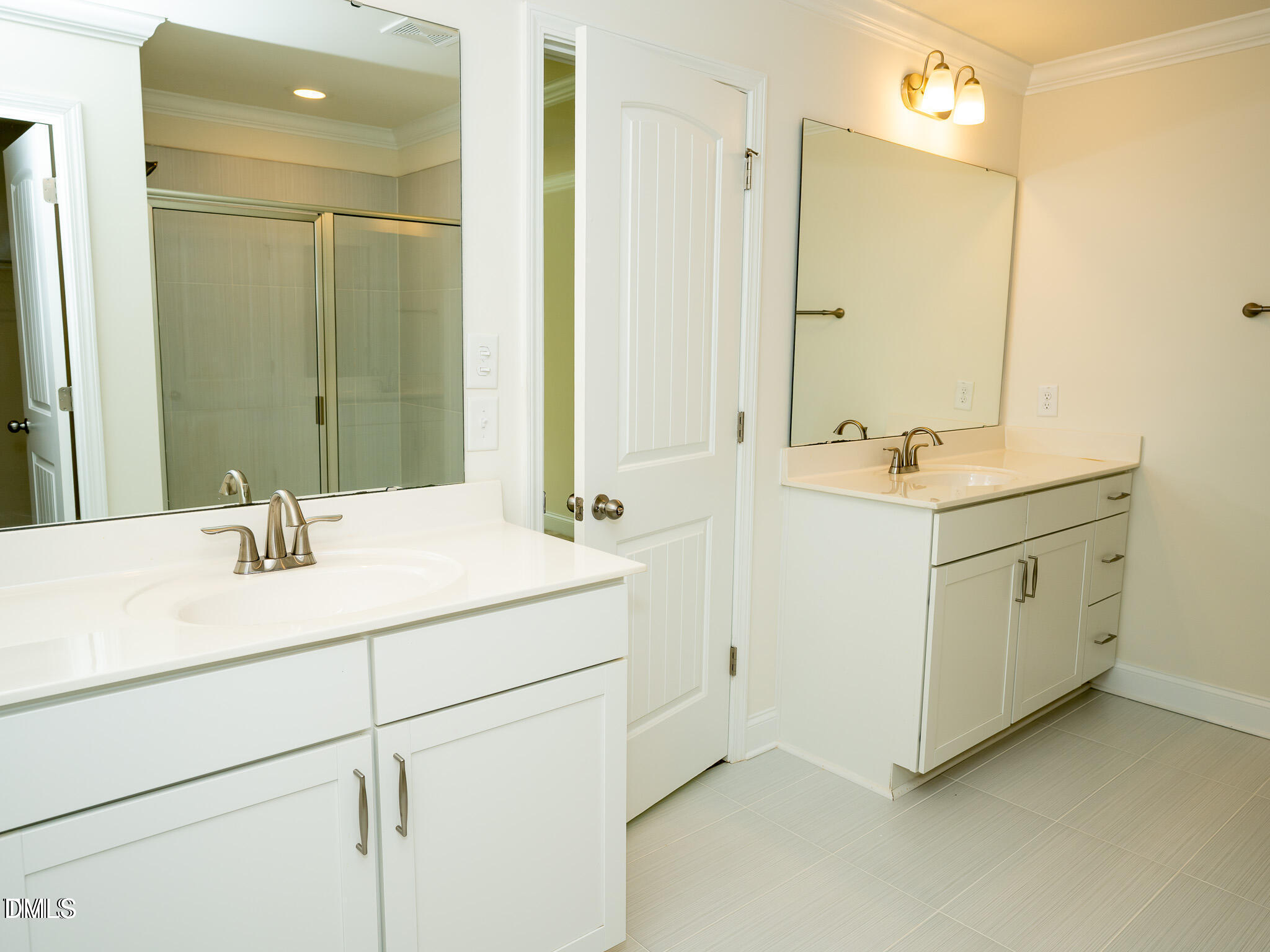 647 Newlyn Drive Raleigh, NC 27606 - Photo 30 of 52 a bathroom with a sink and a mirror