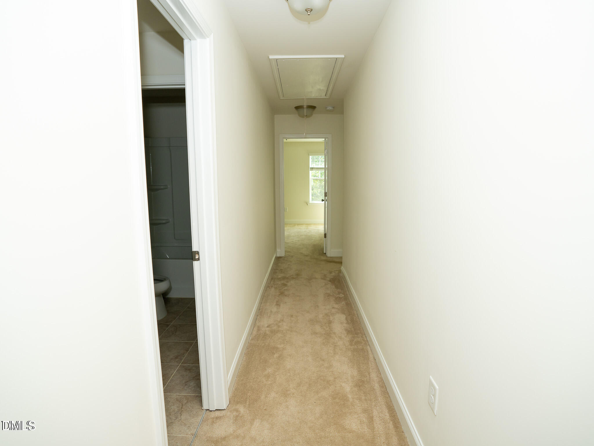 647 Newlyn Drive Raleigh, NC 27606 - Photo 34 of 52 a view of a hallway with white walls