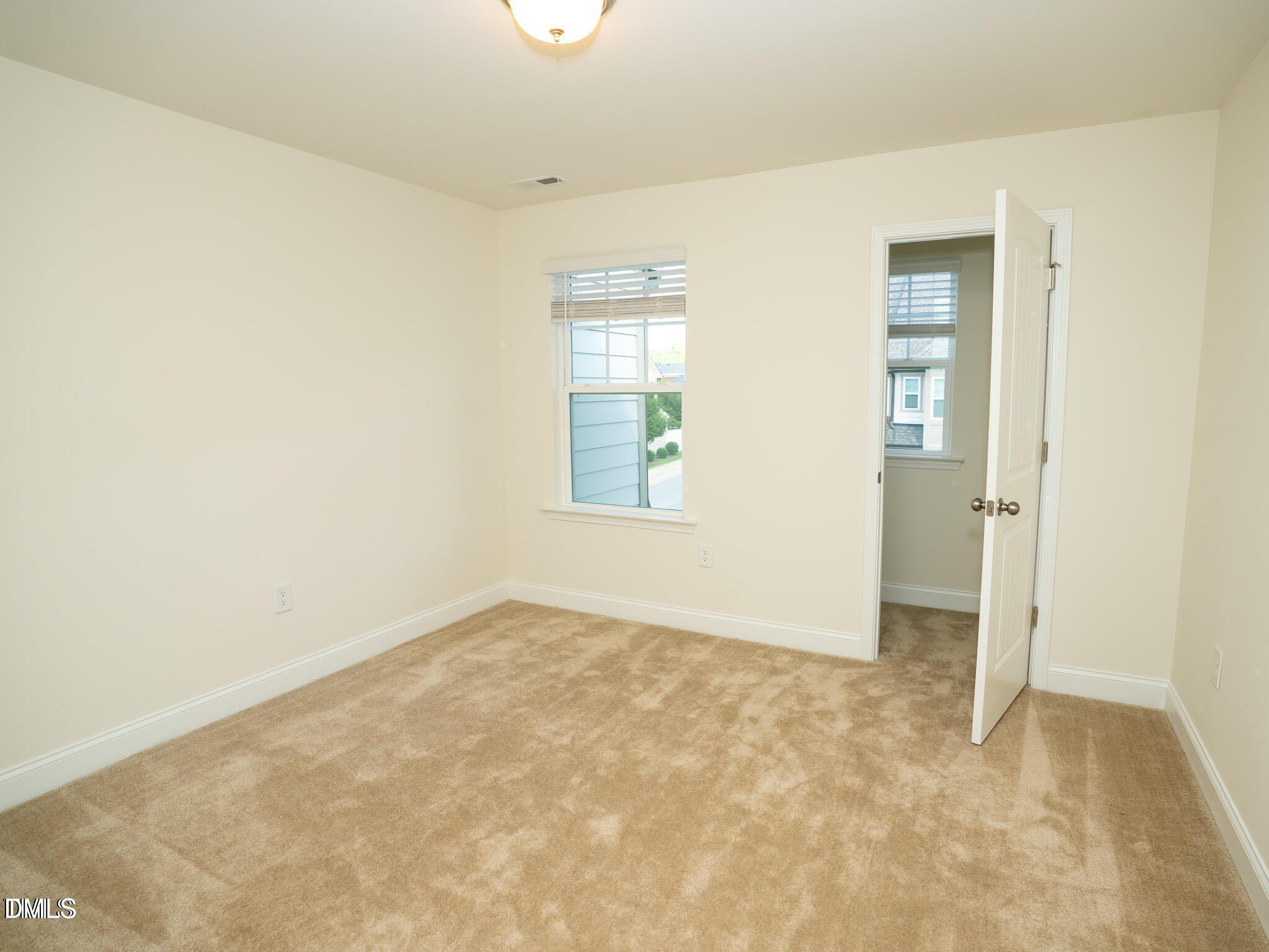647 Newlyn Drive Raleigh, NC 27606 - Photo 38 of 52 an empty room with windows