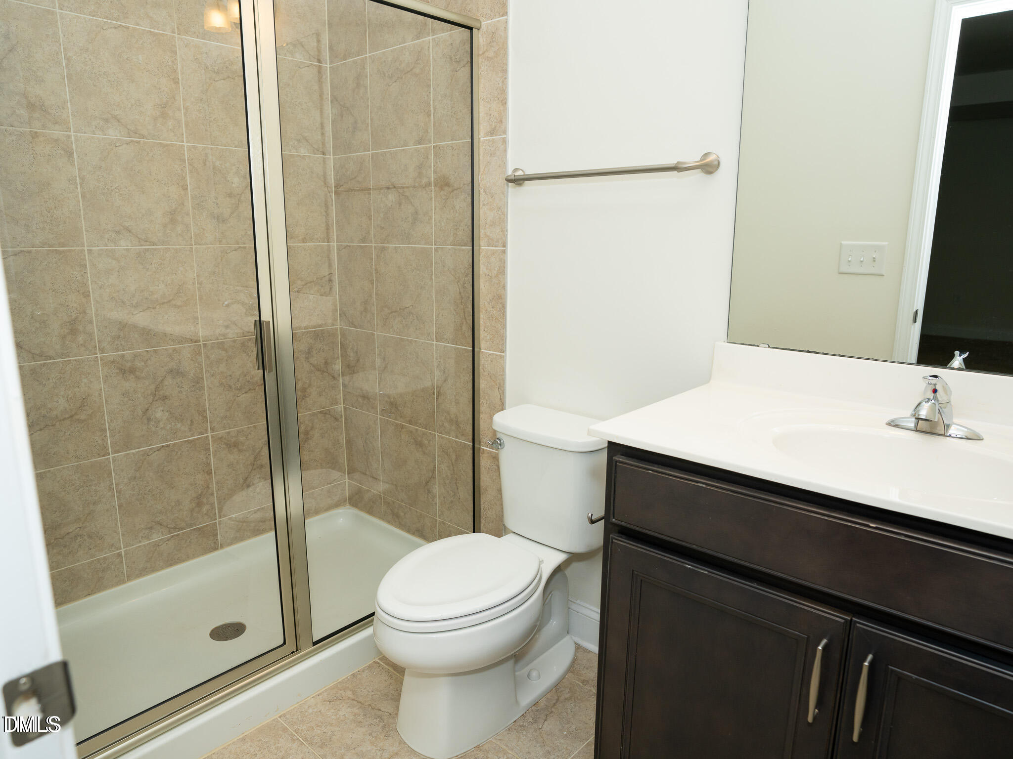 647 Newlyn Drive Raleigh, NC 27606 - Photo 41 of 52 a bathroom with a sink a toilet and shower