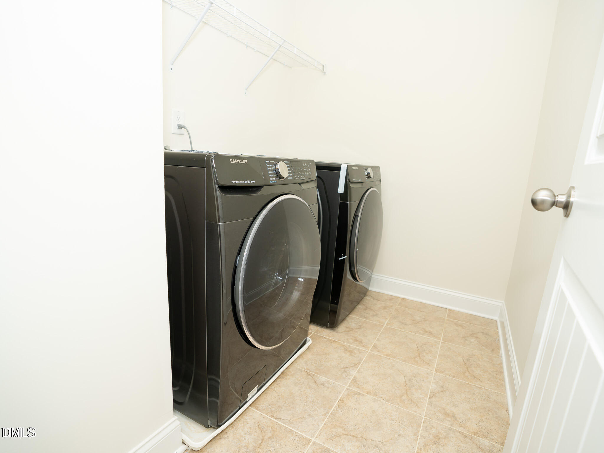 647 Newlyn Drive Raleigh, NC 27606 - Photo 42 of 52 a utility room with dryer and washer