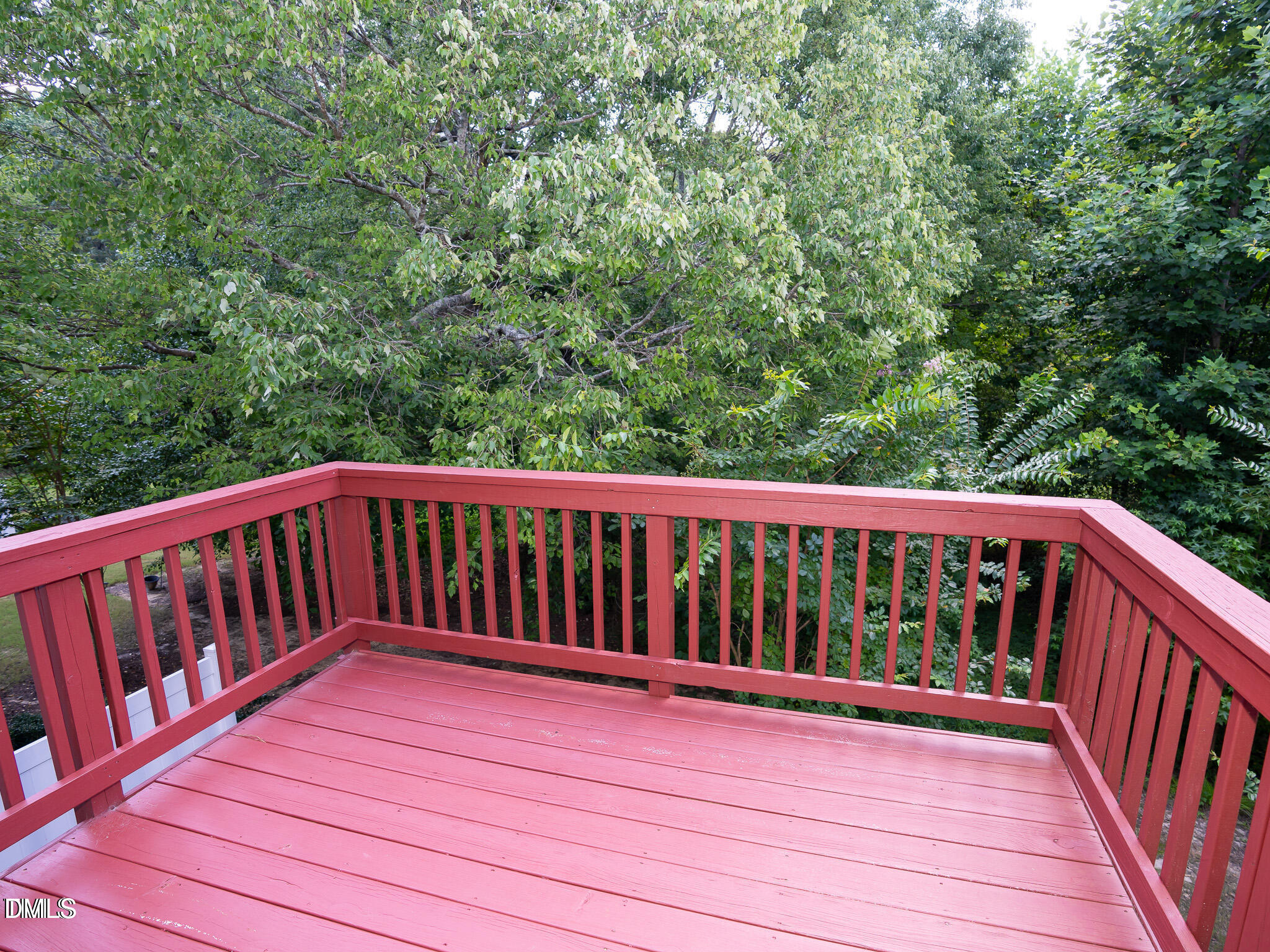 647 Newlyn Drive Raleigh, NC 27606 - Photo 46 of 52 a balcony with wooden floor