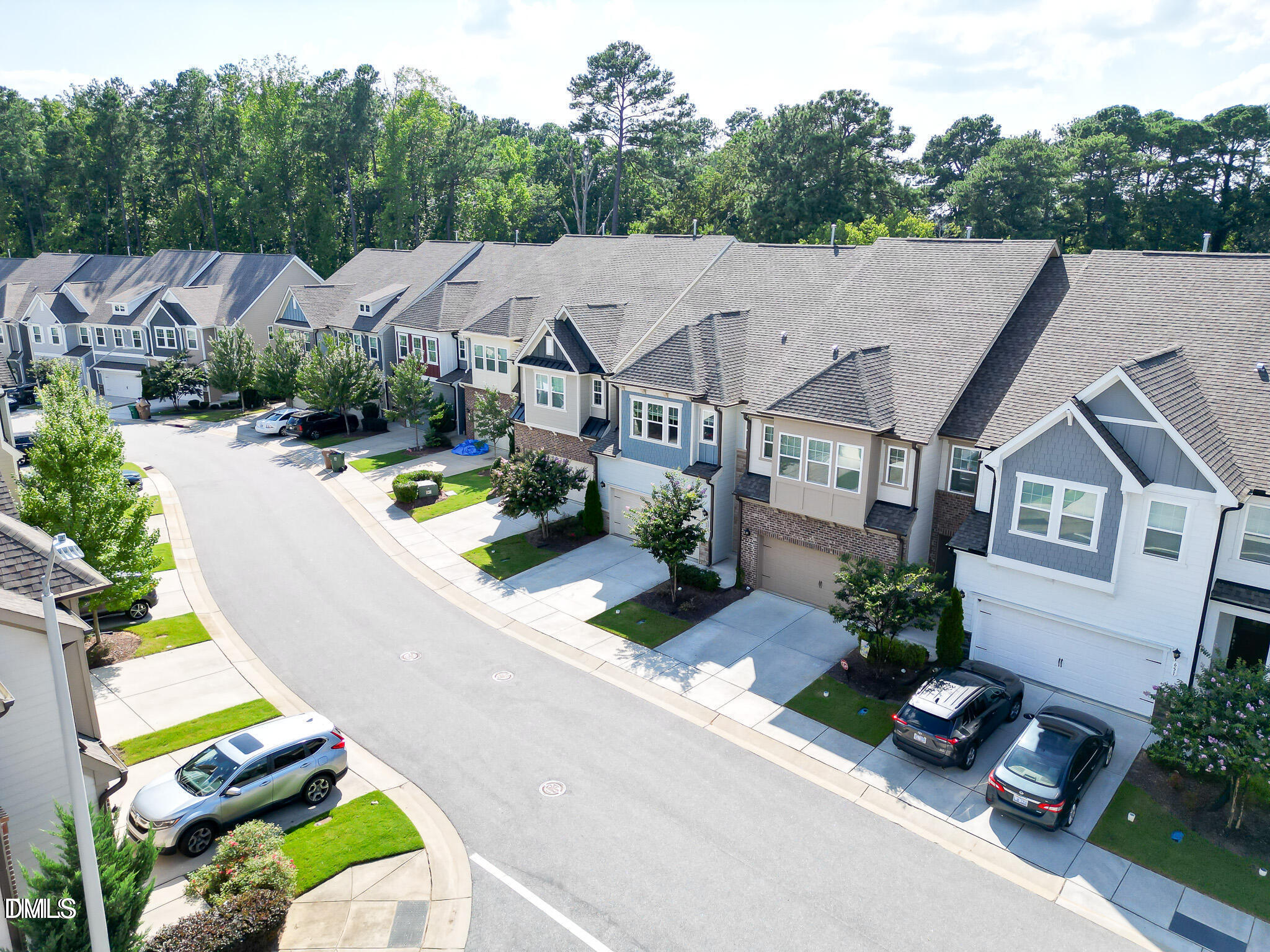 647 Newlyn Drive Raleigh, NC 27606 - Photo 48 of 52 an aerial view of a house with garden space and street view