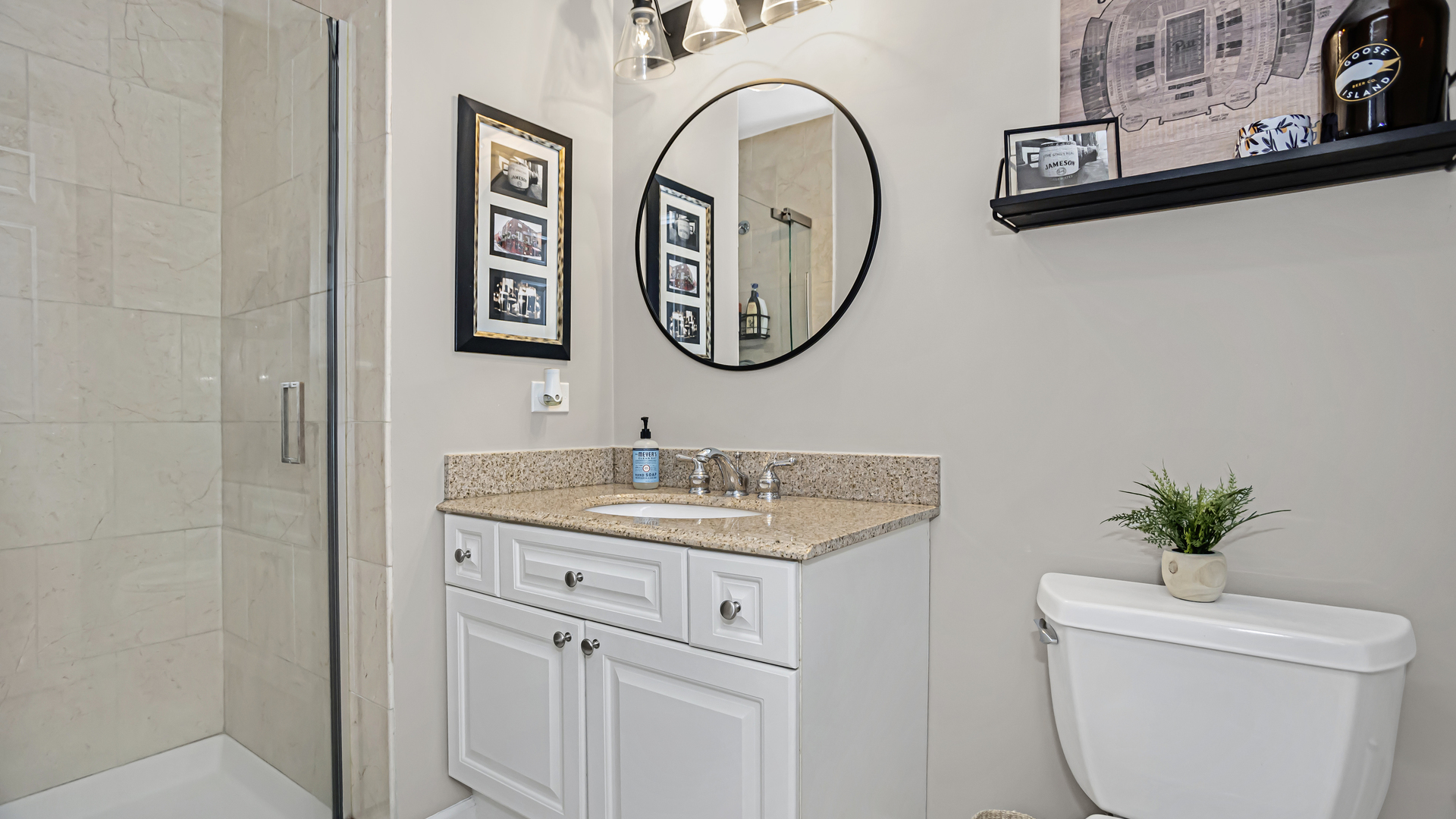 1131 West Wolfram Street, Unit 2 Chicago, IL 60657 - Photo 13 of 15 a bathroom with a toilet a sink and a mirror