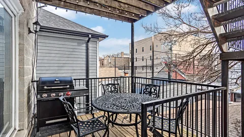a view of a balcony with chairs