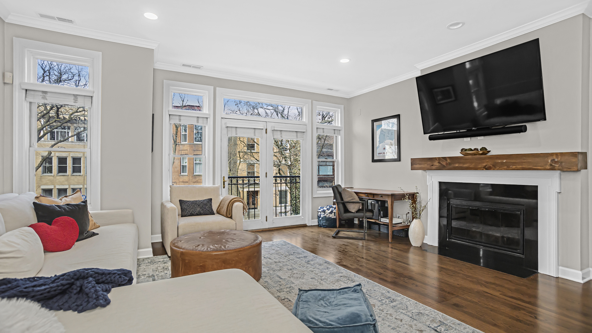 1131 West Wolfram Street, Unit 2 Chicago, IL 60657 - Photo 3 of 15 a living room with furniture and a flat screen tv