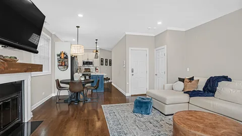 a living room with furniture fireplace and flat screen tv