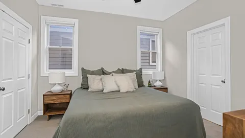 a bed room with a bed and a window