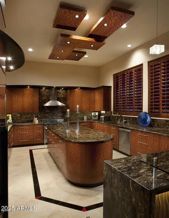 a kitchen with stainless steel appliances granite countertop a stove and a sink