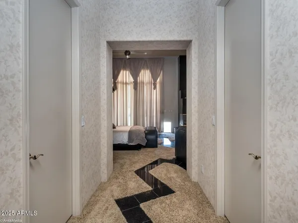 a bathroom with a black white checkered floor