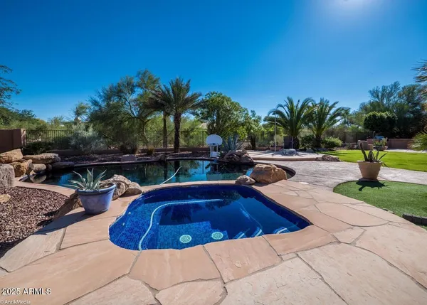 a view of a swimming pool and lounge chair