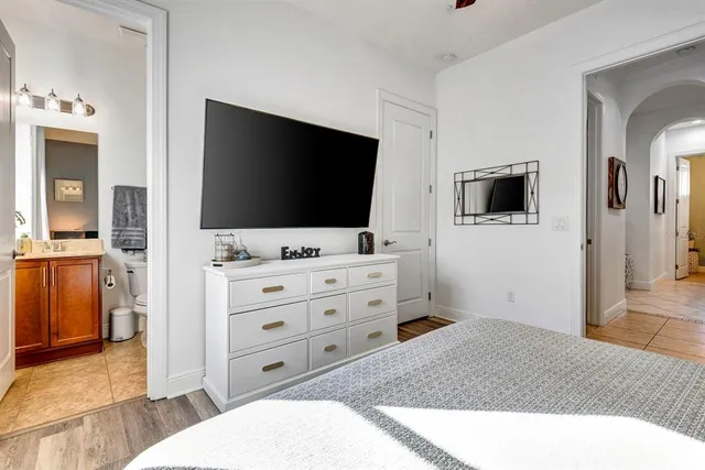 a bed room with a bed and a lamp