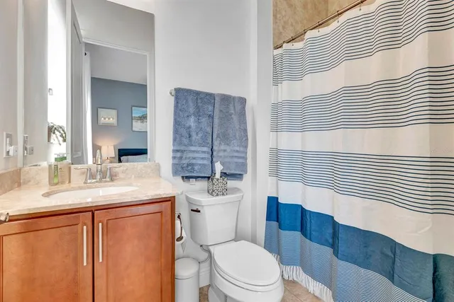 a bathroom with a sink a vanity and a mirror