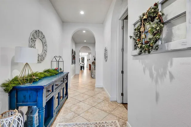 a bedroom with a large bed and a flat screen tv