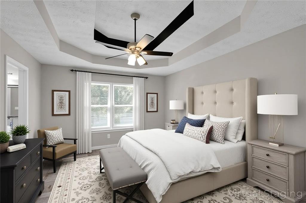 281 Cedars Glen Circle Villa Rica, GA 30180 - Photo 18 of 52 a bedroom with a large bed and a window