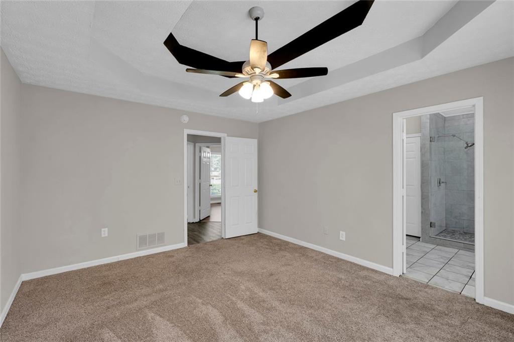 281 Cedars Glen Circle Villa Rica, GA 30180 - Photo 20 of 52 a view of an empty room and chandelier fan